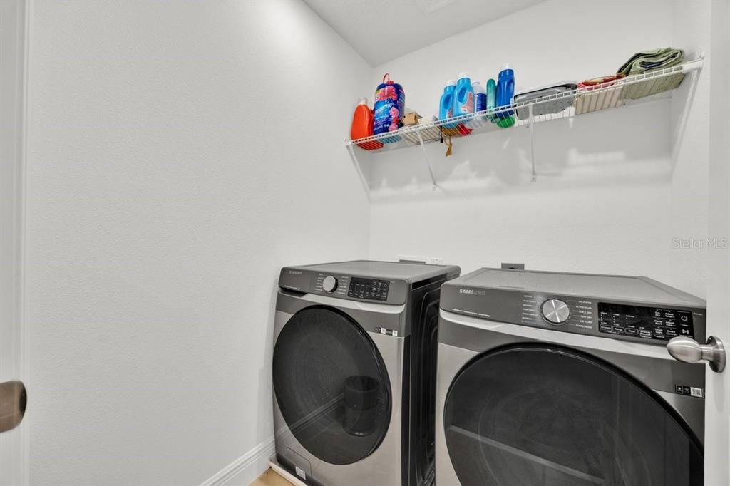 5237 Royal Point Avenue Kissimmee, FL 34746 - Photo 17 of 28 a utility room with dryer and washer