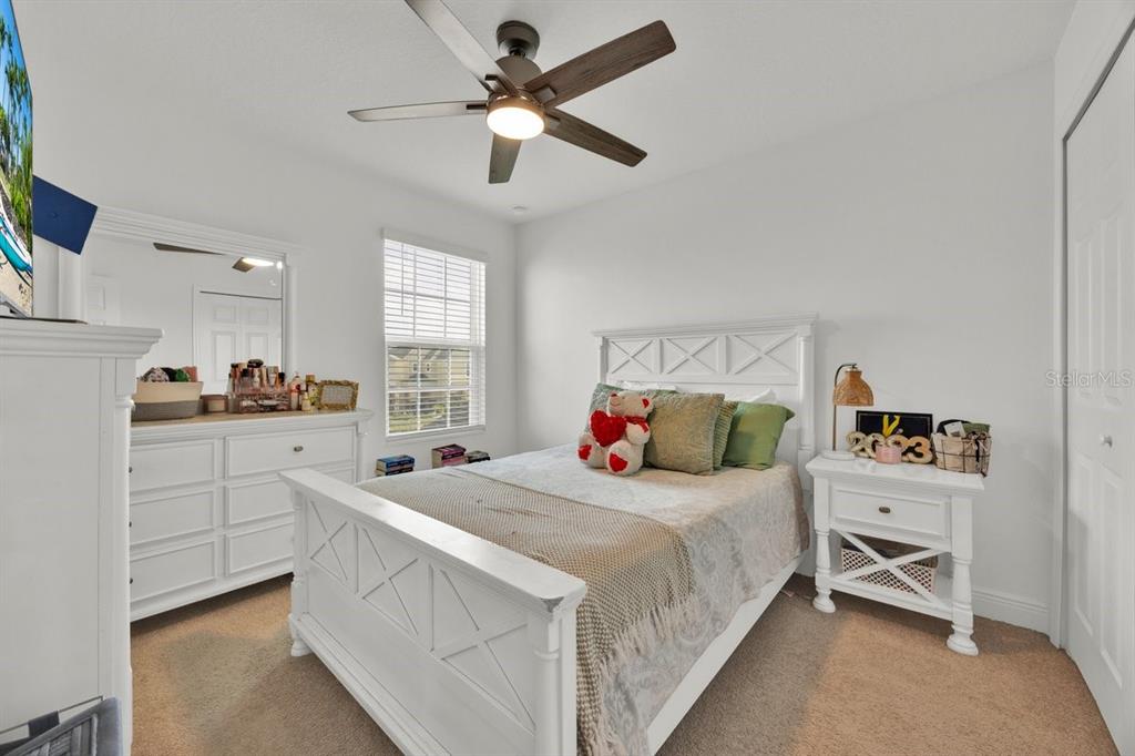5237 Royal Point Avenue Kissimmee, FL 34746 - Photo 19 of 28 a bedroom with a bed and a window