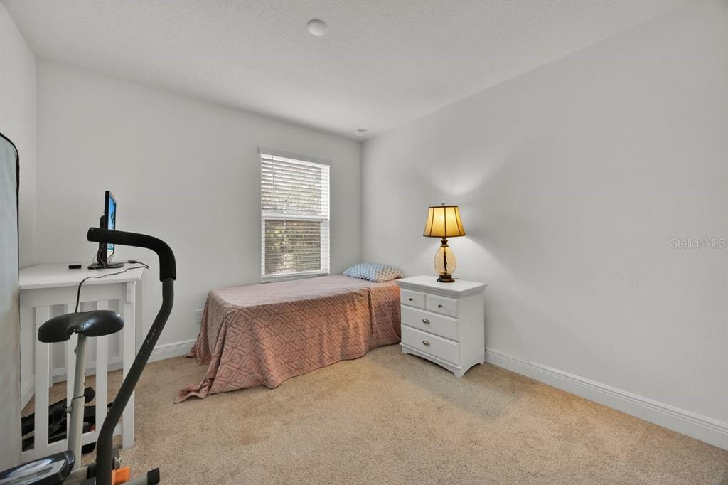 5237 Royal Point Avenue Kissimmee, FL 34746 - Photo 20 of 28 a bed room with a bed and a window
