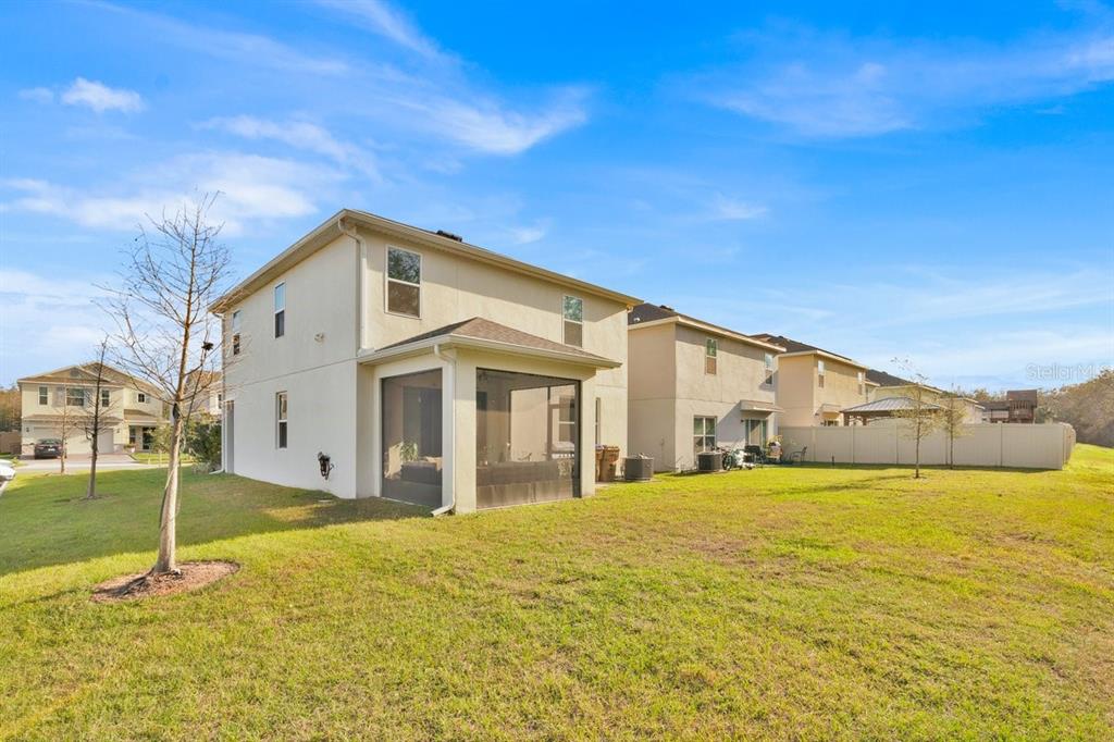 5237 Royal Point Avenue Kissimmee, FL 34746 - Photo 24 of 28 a large white house with a large pool