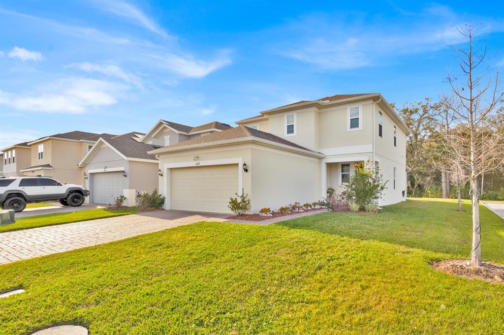 5237 Royal Point Avenue Kissimmee, FL 34746 - Photo 27 of 28 a view of an house with backyard and garden