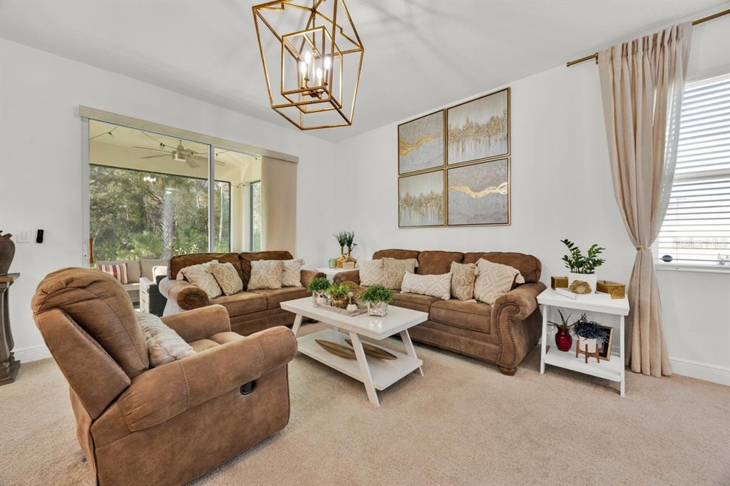 5237 Royal Point Avenue Kissimmee, FL 34746 - Photo 6 of 28 a living room with furniture and a large window