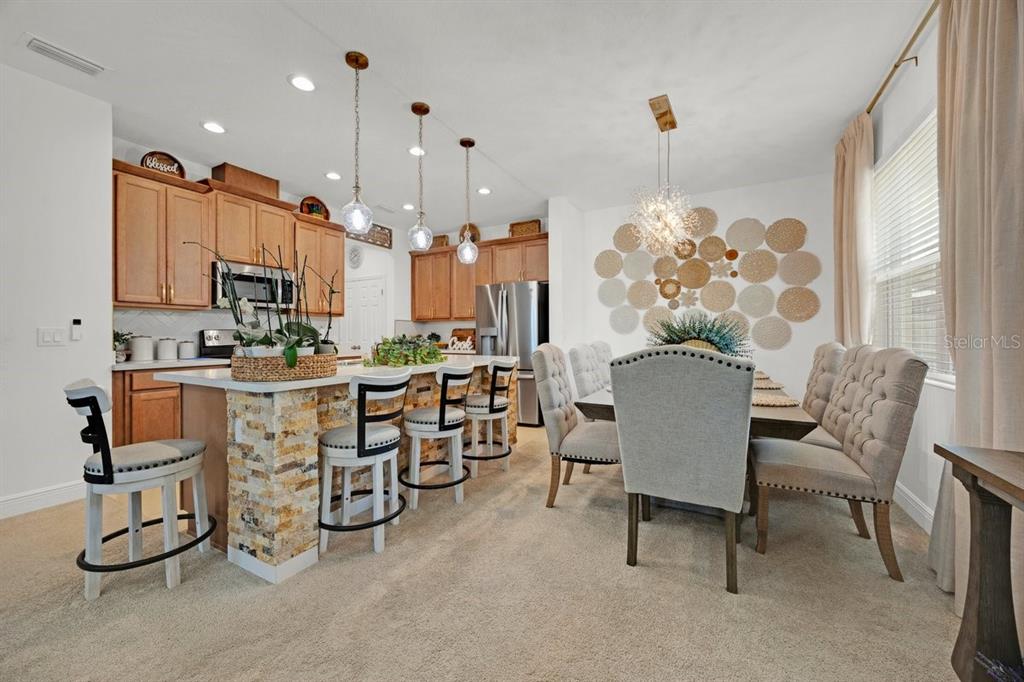 5237 Royal Point Avenue Kissimmee, FL 34746 - Photo 7 of 28 a view of a dining room with furniture