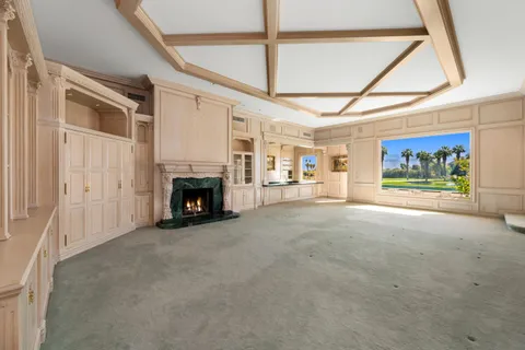 a bathroom with a sink and a large mirror next to a window