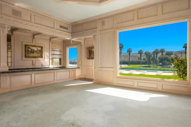 a kitchen with granite countertop a sink and cabinets