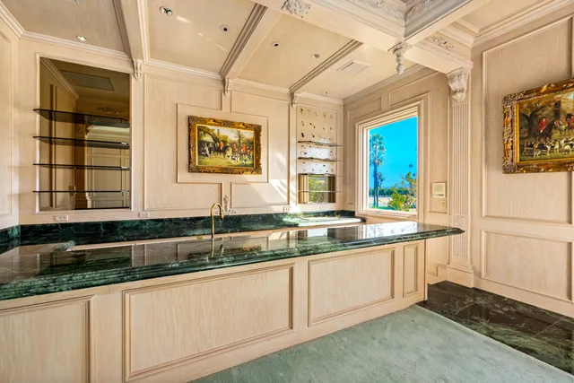 a spacious bathroom with a granite countertop sink mirror and a bathtub