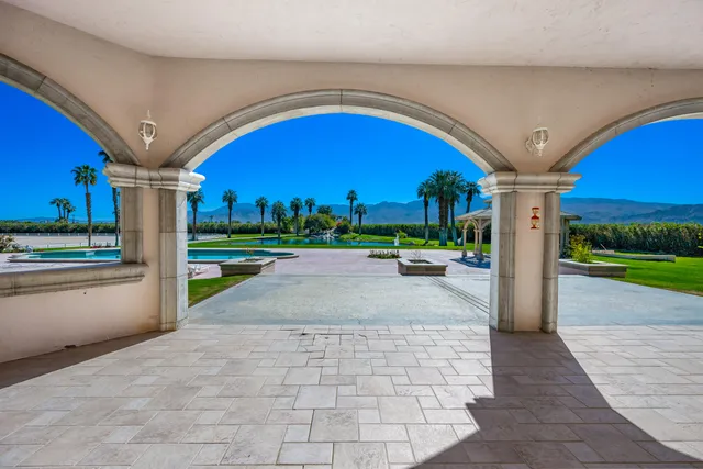 a large kitchen with kitchen island a sink stainless steel appliances and cabinets