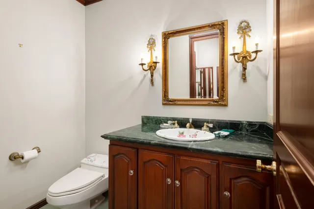 a spacious bathroom with a shower a sink and a mirror