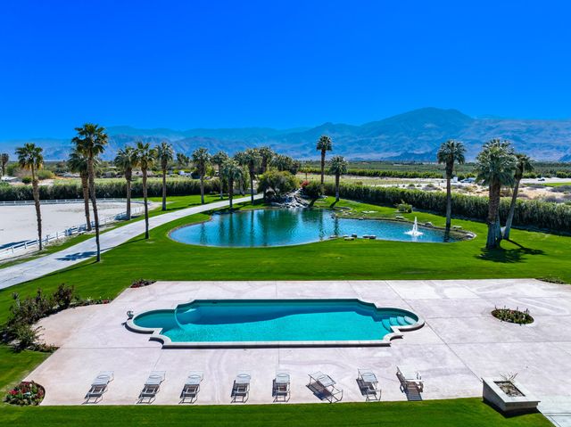 a view of a swimming pool with a yard