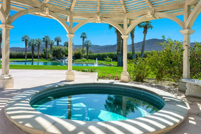 a view of a backyard with swimming pool