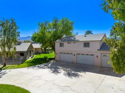 a bathroom with a sink vanity granite and shower