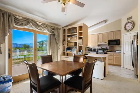 a utility room with cabinets washer and dryer
