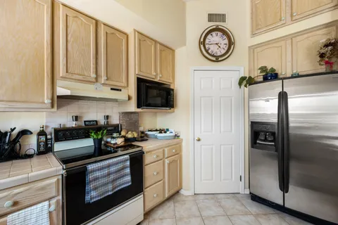 a view of a garden with a house