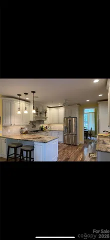a bathroom with a sink mirror and toilet