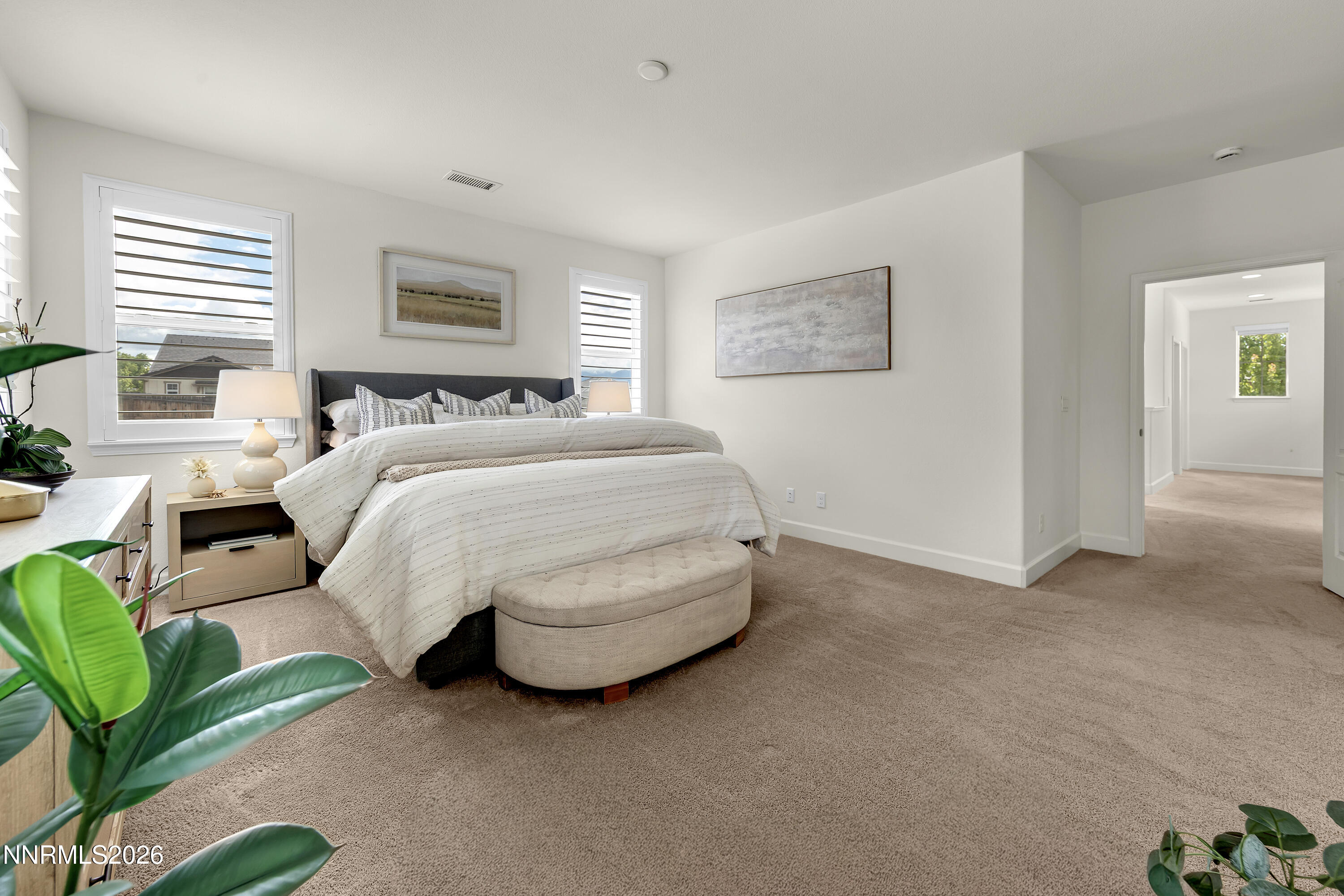 10150 Barrel Racer Drive Reno, NV 89521 - Photo 53 of 64 a spacious bedroom with a bed and a couch