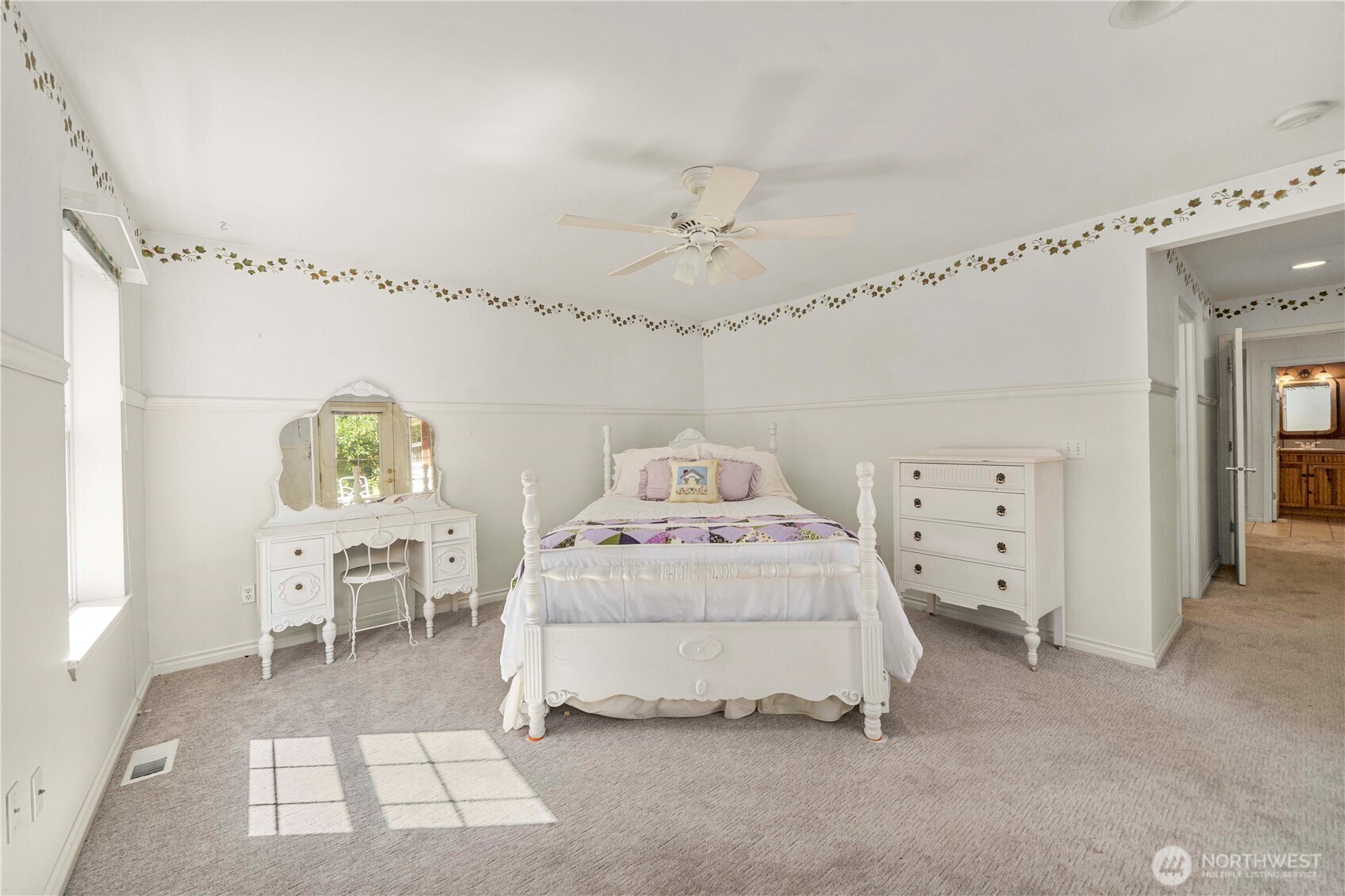 2469 South 224th Street Des Moines, WA 98198 - Photo 17 of 40 a spacious bedroom with a bed and window