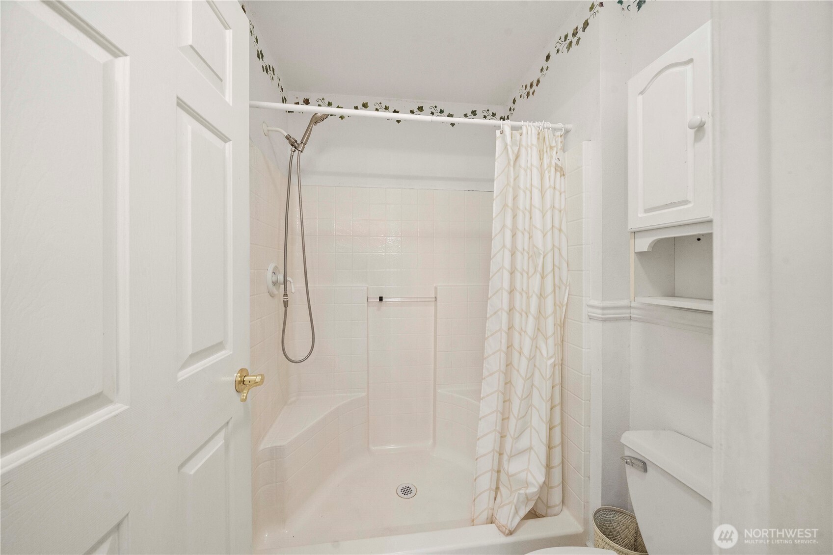 2469 South 224th Street Des Moines, WA 98198 - Photo 18 of 40 a bathroom with a glass shower door