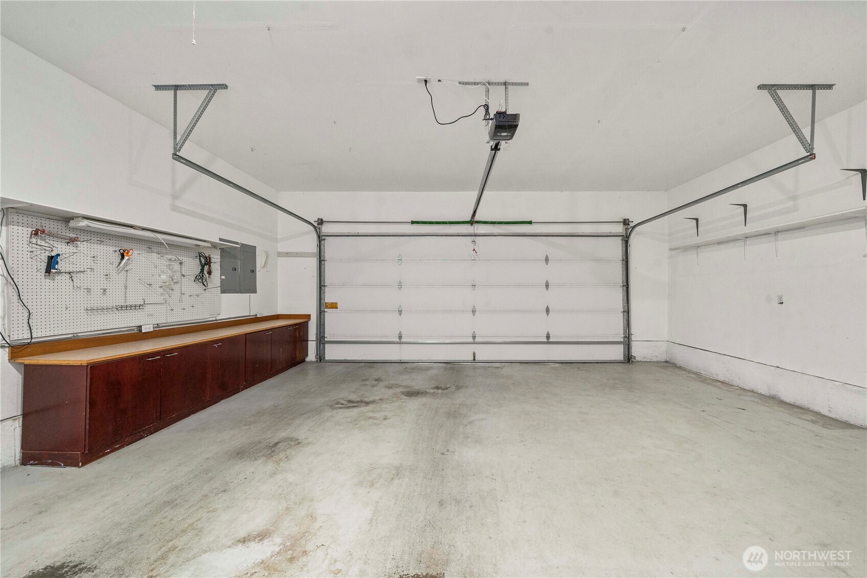 2469 South 224th Street Des Moines, WA 98198 - Photo 20 of 40 a view of a garage with furniture