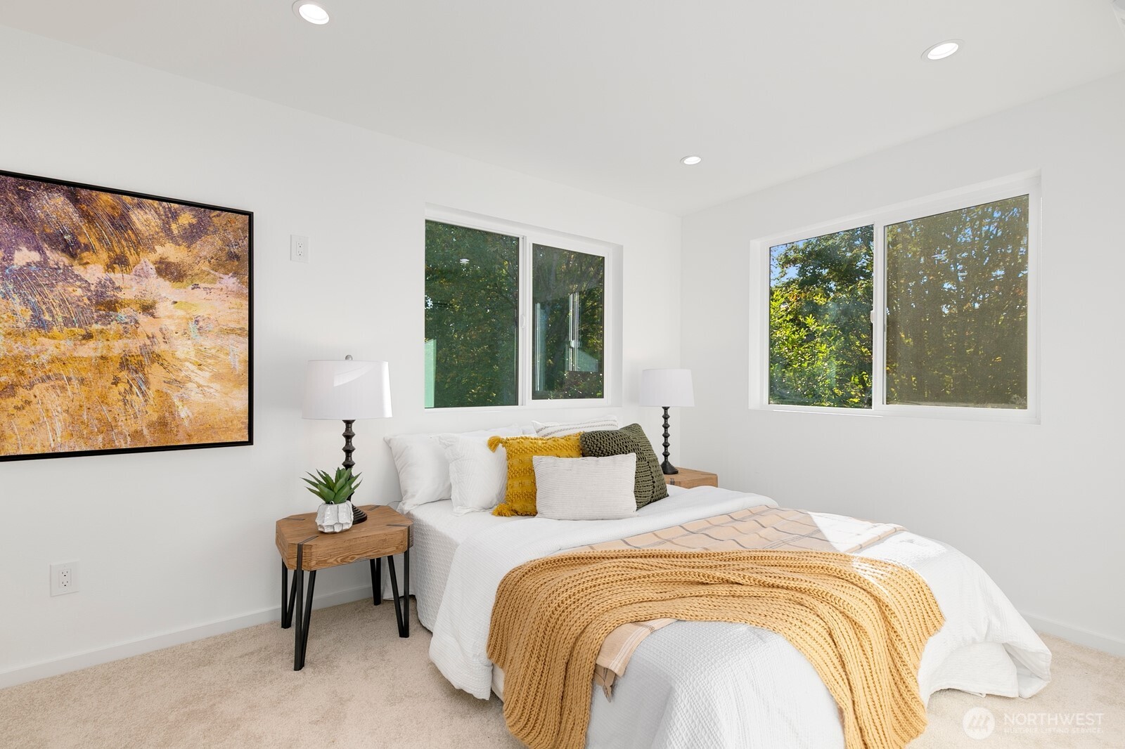4531 26th Avenue Southwest Seattle, WA 98106 - Photo 17 of 22 a bedroom with a bed and a painting on the wall