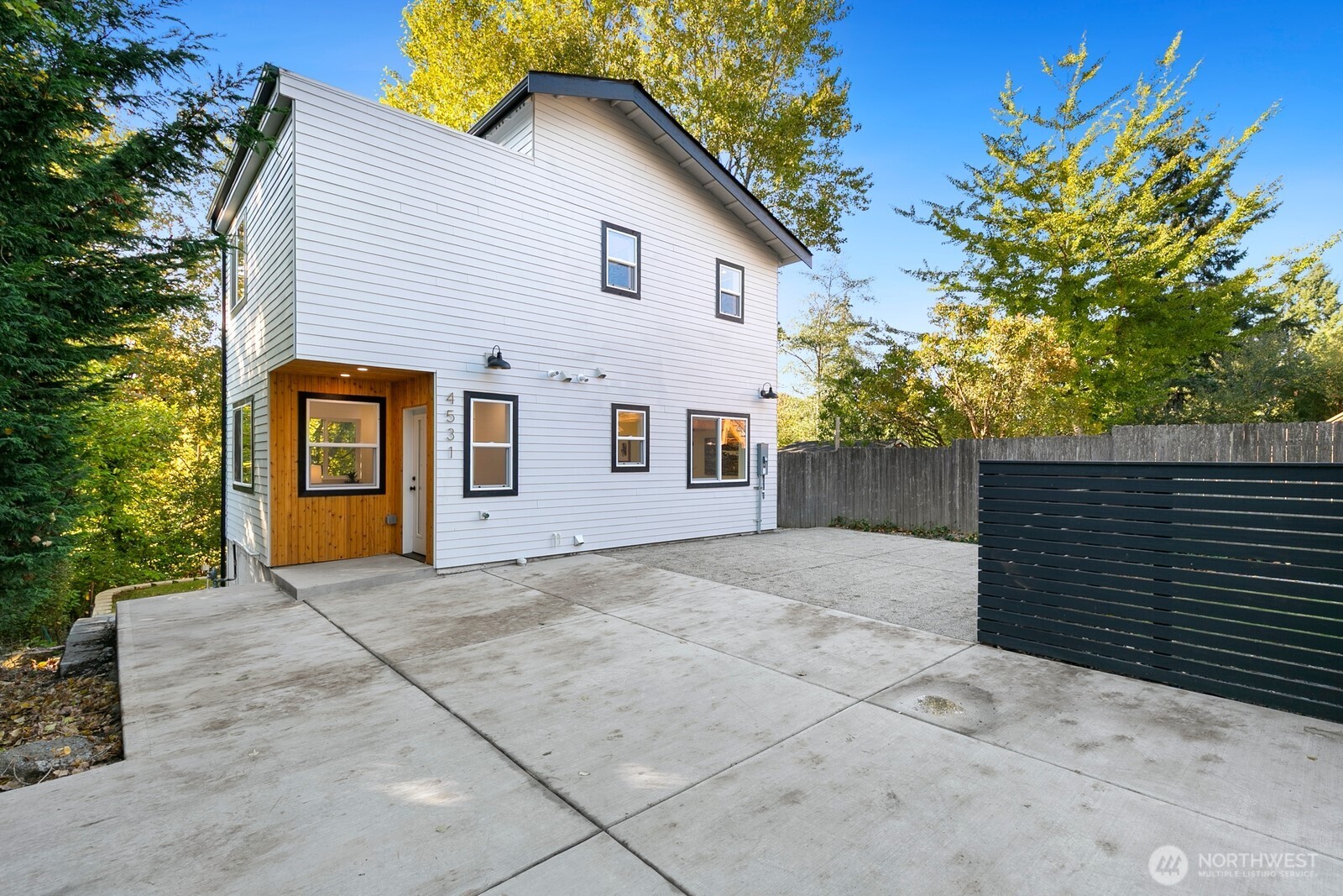 4531 26th Avenue Southwest Seattle, WA 98106 - Photo 2 of 22 a view of a house with a yard and potted plants