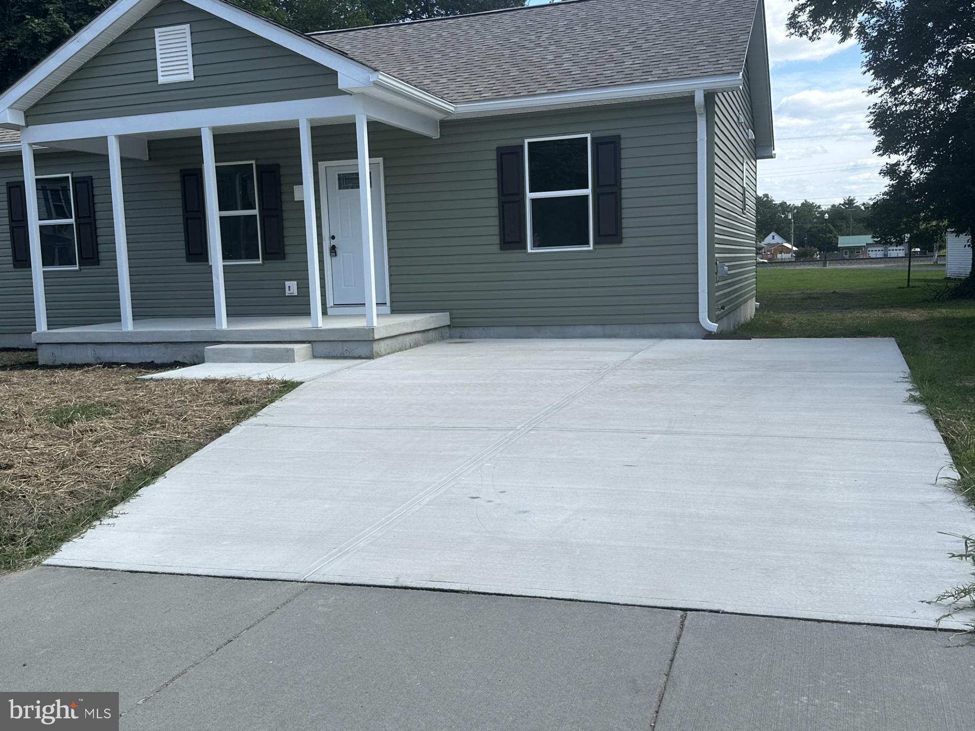 107 Broad Street Hurlock, MD 21643 - Photo 3 of 34 Showing large driveway.