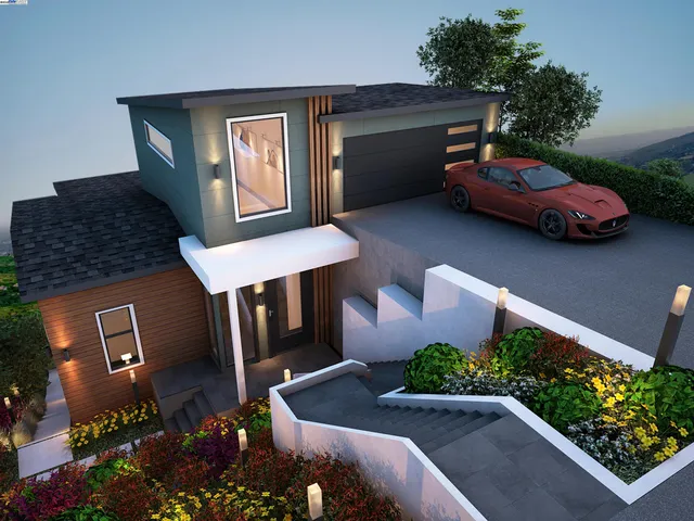 a front view of a house with lots of flowers and trees