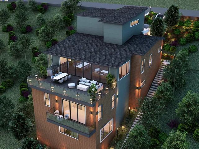 an aerial view of house with outdoor space and sitting area