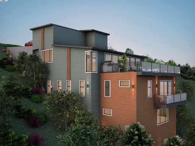 a front view of a house with plants and entryway