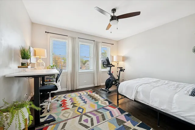 a bedroom that has a bed and a table in it