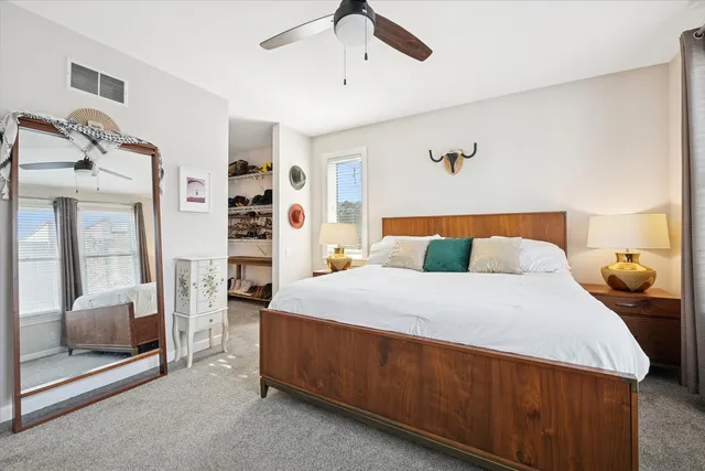 a bedroom with a bed and a walk in closet