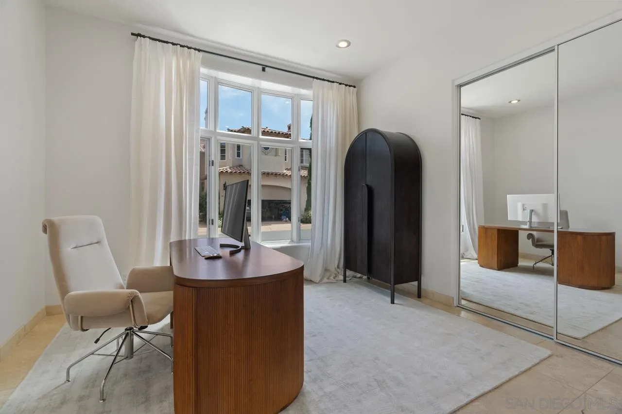 9678 Claiborne Square La Jolla, CA 92037 - Photo 28 of 38 a dining room with furniture and wooden floor
