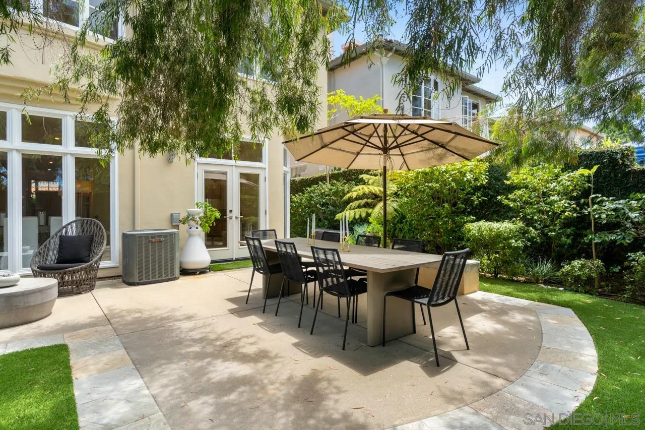 9678 Claiborne Square La Jolla, CA 92037 - Photo 35 of 38 a patio with a patio table and chairs