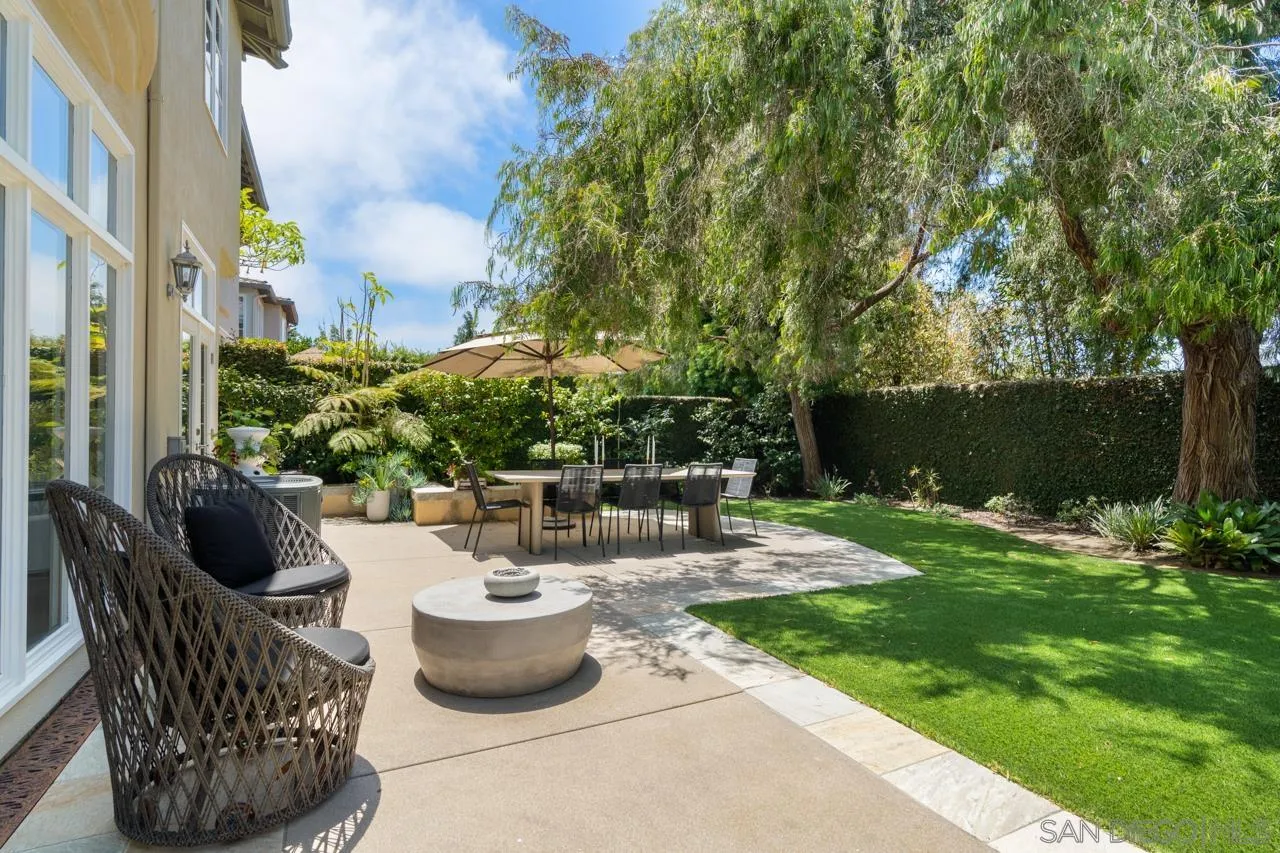 9678 Claiborne Square La Jolla, CA 92037 - Photo 5 of 38 a view of a patio with chairs and potted plants