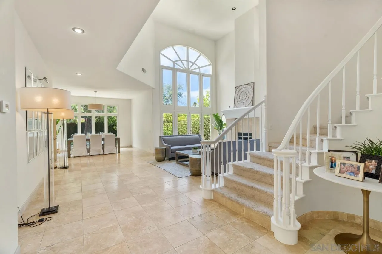 9678 Claiborne Square La Jolla, CA 92037 - Photo 6 of 38 a view of an entryway with dining room and livingroom view