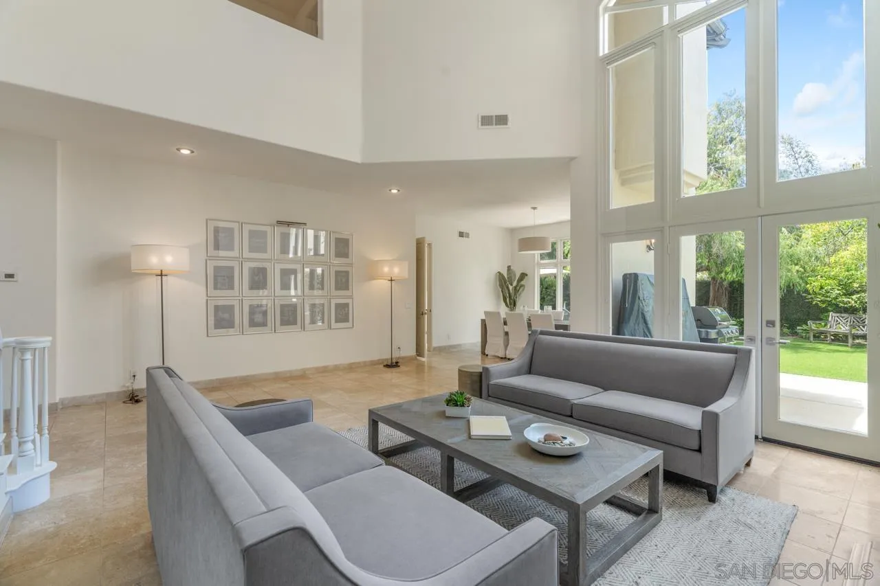9678 Claiborne Square La Jolla, CA 92037 - Photo 8 of 38 a living room with furniture and a large window