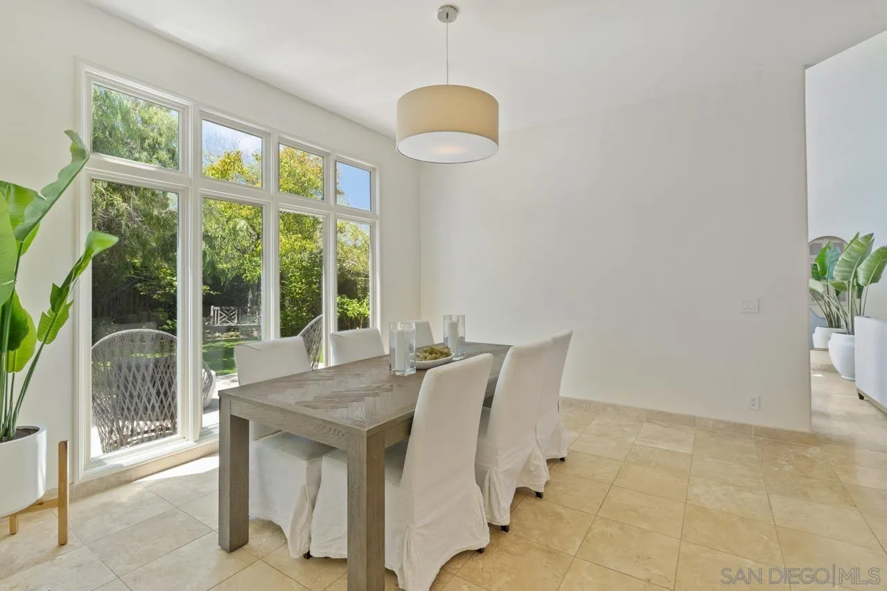 9678 Claiborne Square La Jolla, CA 92037 - Photo 9 of 38 a view of a dining room with furniture window and outside view
