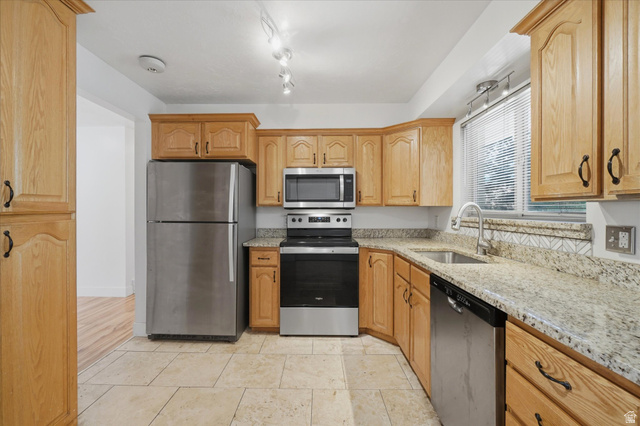 392 Perrine Drive Midvale, UT 84047 - Photo 9 of 37 Kitchen with stainless steel appliances, refrigerator stays!