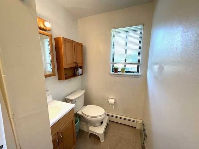 3 Hook Road, Unit 55G Poughkeepsie, NY 12601 - Photo 10 of 13 a bathroom with a toilet a sink and mirror