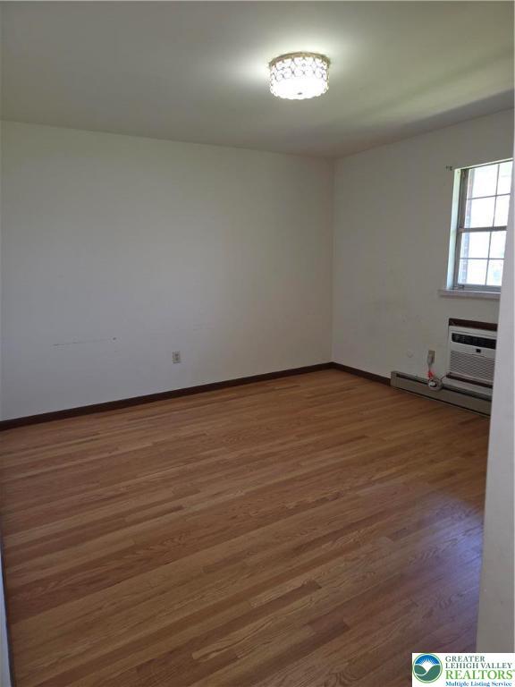 2280 Linden Street, Unit 2N Bethlehem, PA 18017 - Photo 12 of 14 an empty room with wooden floor and windows