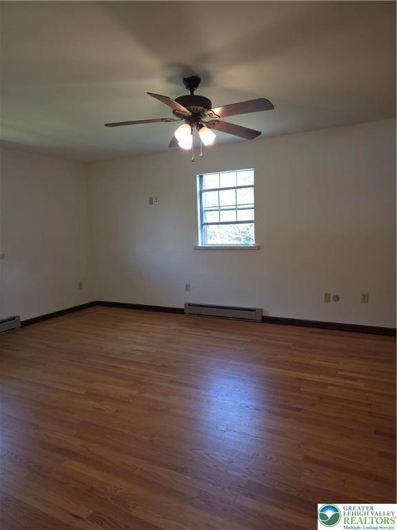 2280 Linden Street, Unit 2N Bethlehem, PA 18017 - Photo 13 of 14 an empty room with wooden floor fan and windows