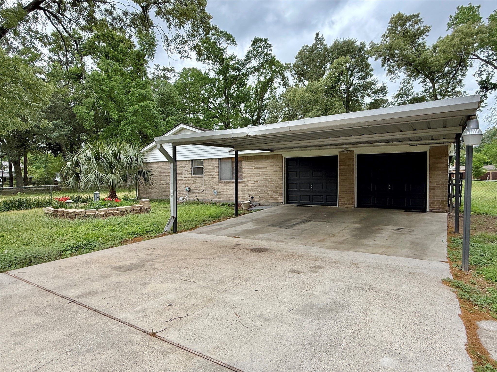 2043 Cherry Laurel Spring, TX 77386 - Photo 43 of 50 2 car garage & Carport