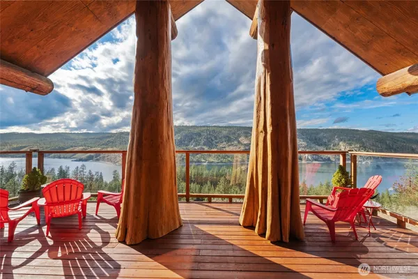 a view of a two chairs in the balcony