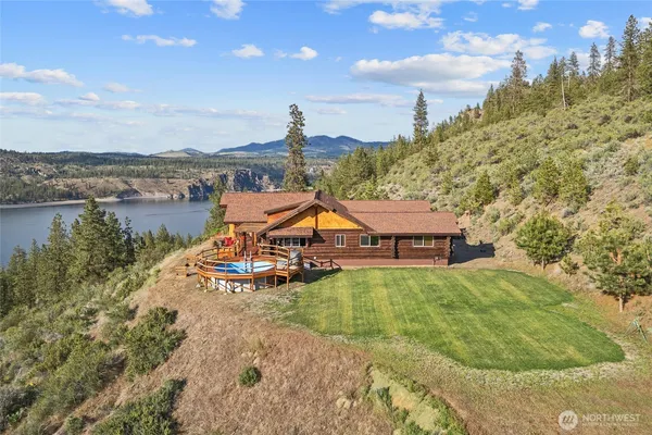a view of a lake with a house in the background