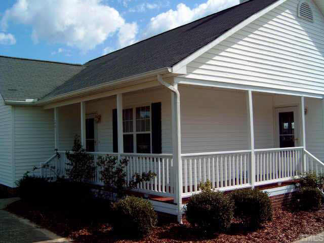 201 Old Fairground Road Willow Spring, NC 27592 - Photo 7 of 8 Wrap-around Porch