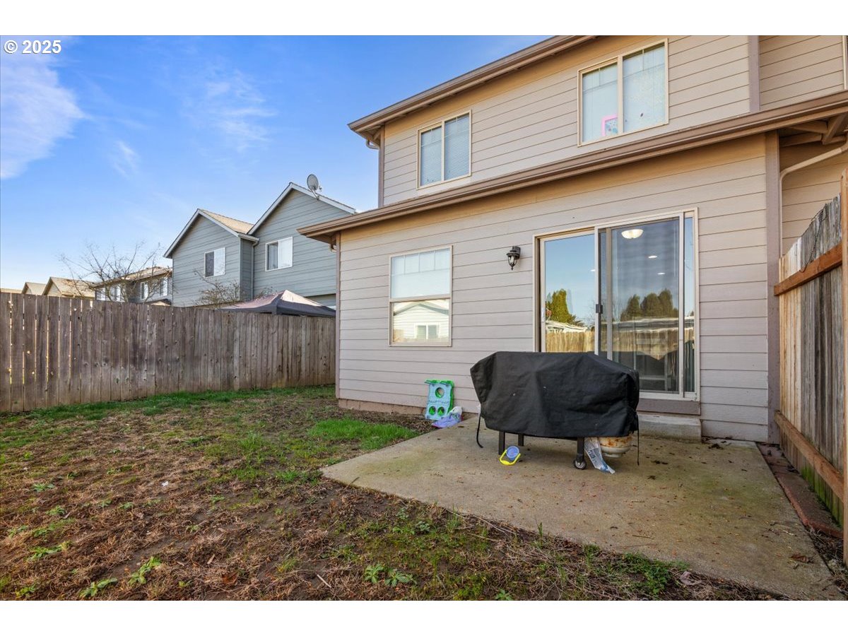 4135 Geranium Loop Northeast Salem, OR 97305 - Photo 18 of 18 a backyard of a house with table and chairs