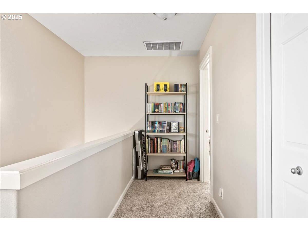 4135 Geranium Loop Northeast Salem, OR 97305 - Photo 10 of 18 a living room with furniture and a book shelf