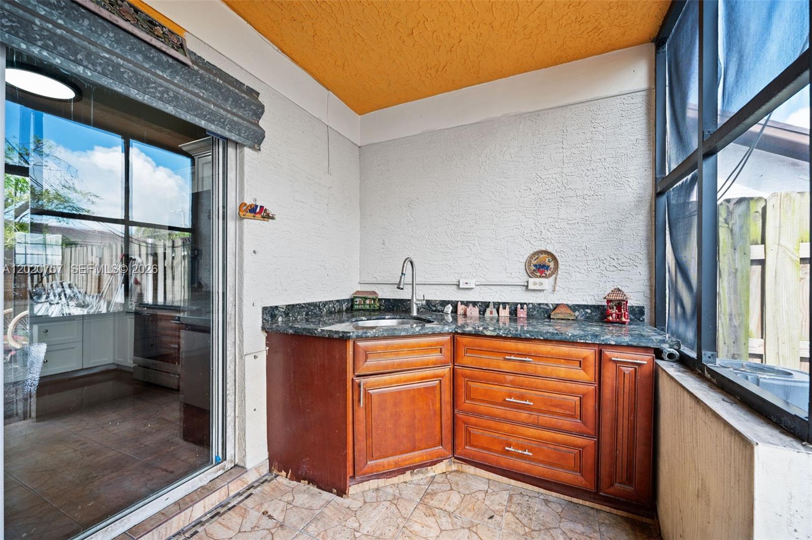 255 East 3rd Street, Unit 1 Hialeah, FL 33010 - Photo 24 of 38 a kitchen with granite countertop a sink stove and cabinets