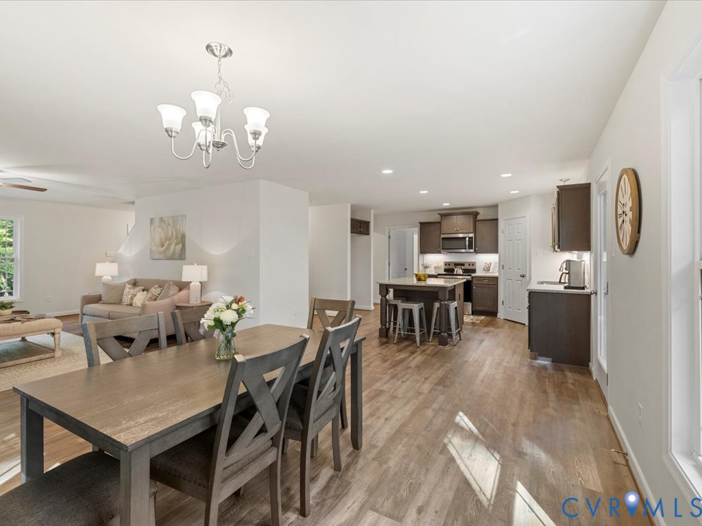 1146 Clayton Road Powhatan, VA 23139 - Photo 11 of 42 a view of a dining room with furniture and chandelier
