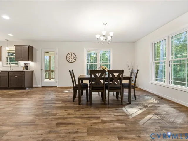 a view of a dining room with furniture and window