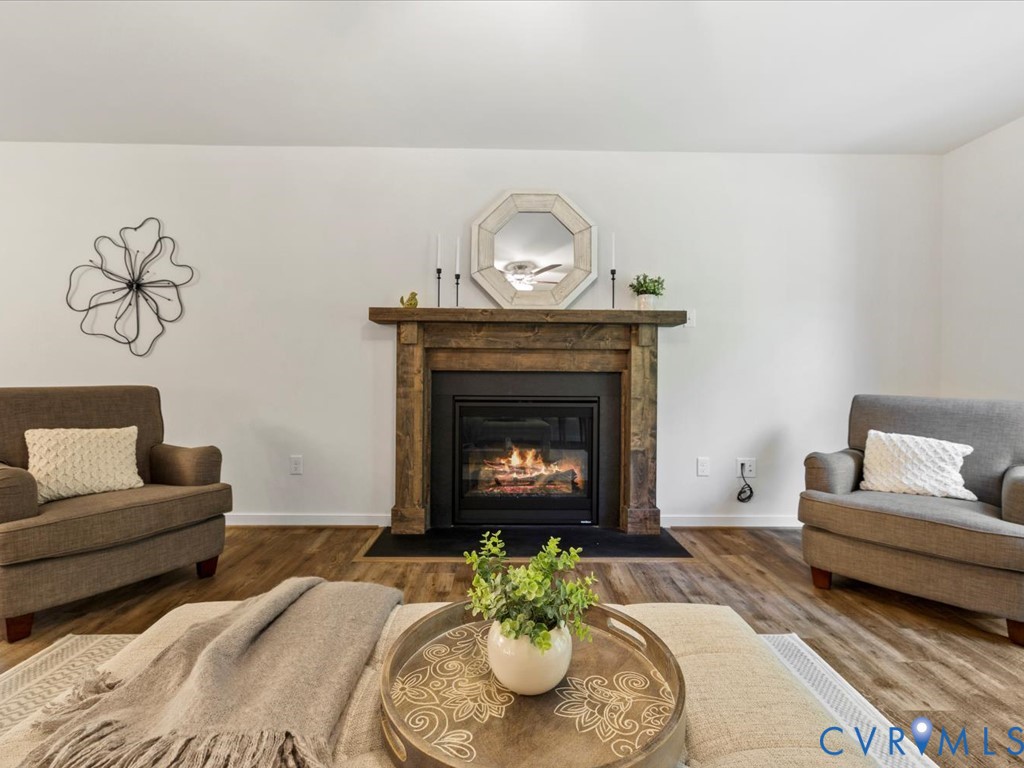 1146 Clayton Road Powhatan, VA 23139 - Photo 17 of 42 a living room with furniture and a fireplace